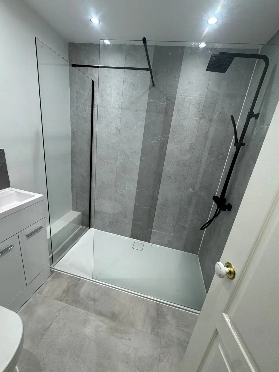 Walk-in shower with grey panelling and matt black fittings, Middlesbrough