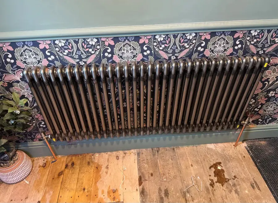 Cast iron column radiator installed with copper pipework